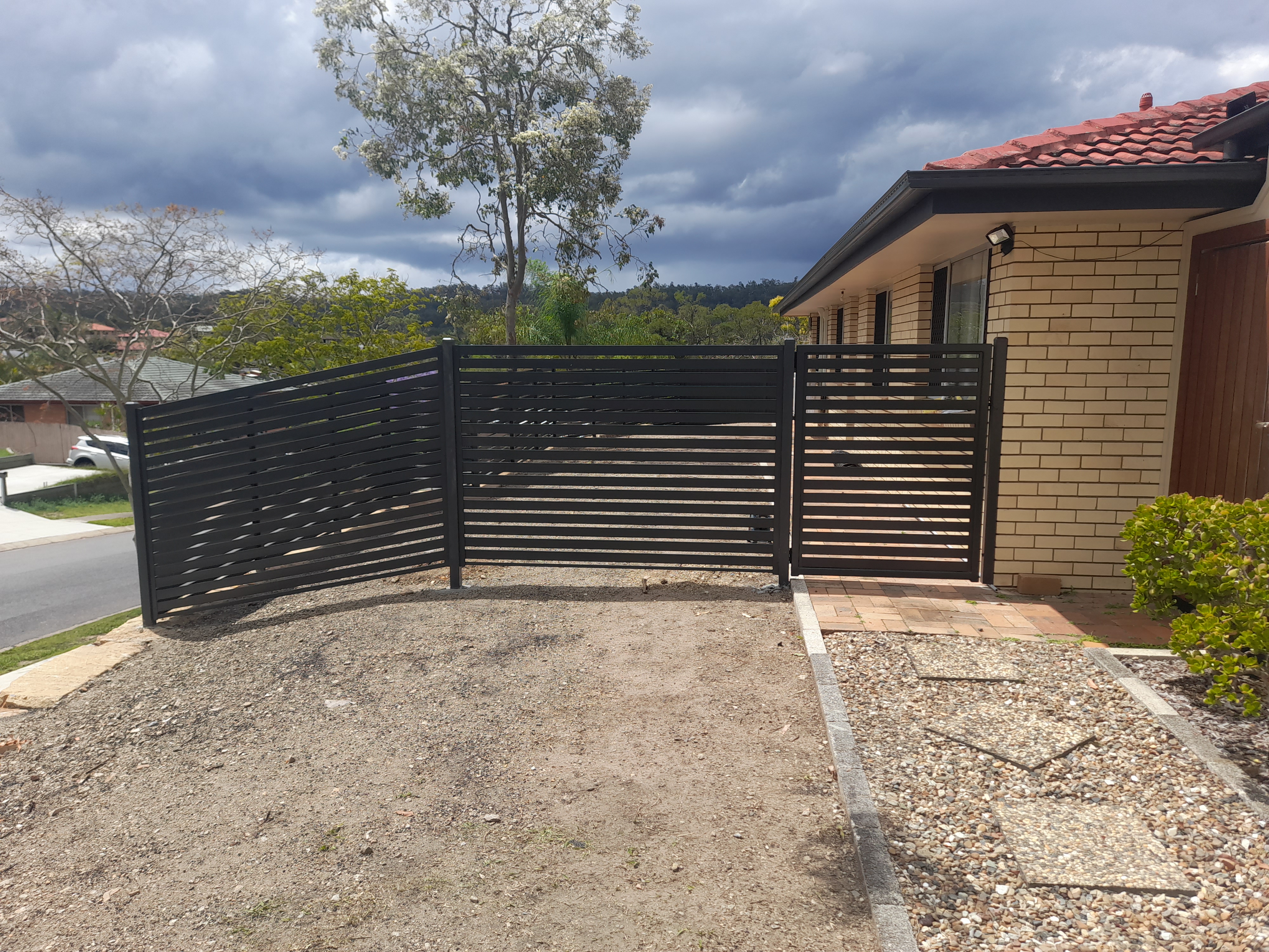 Low black horizontal slat aluminium boundary fence in Redcliffe - Gateflex, Redcliffe