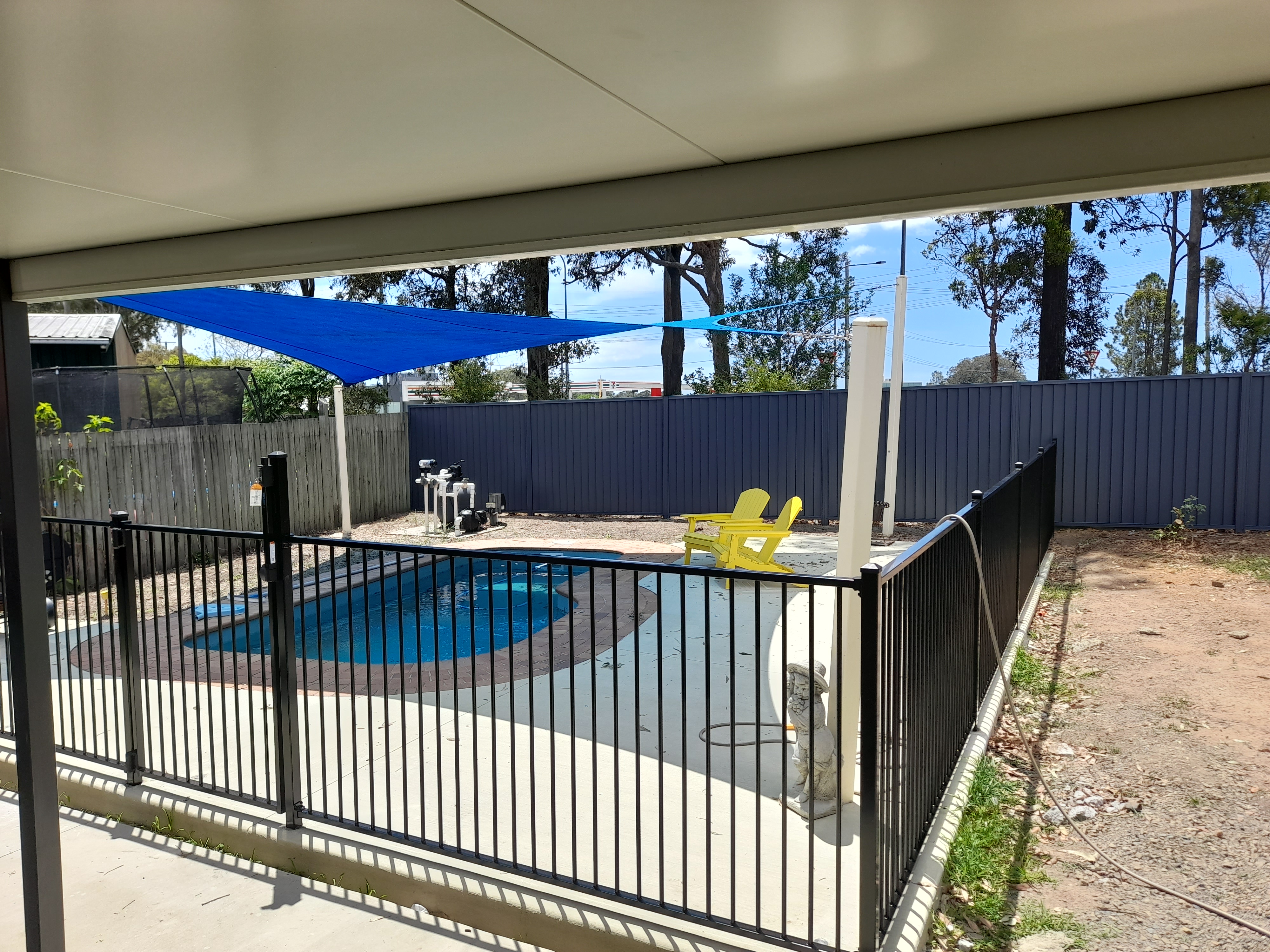 Black tubular front fence installed at a suburban brick home in the Moreton Bay region - Gateflex, Caboolture