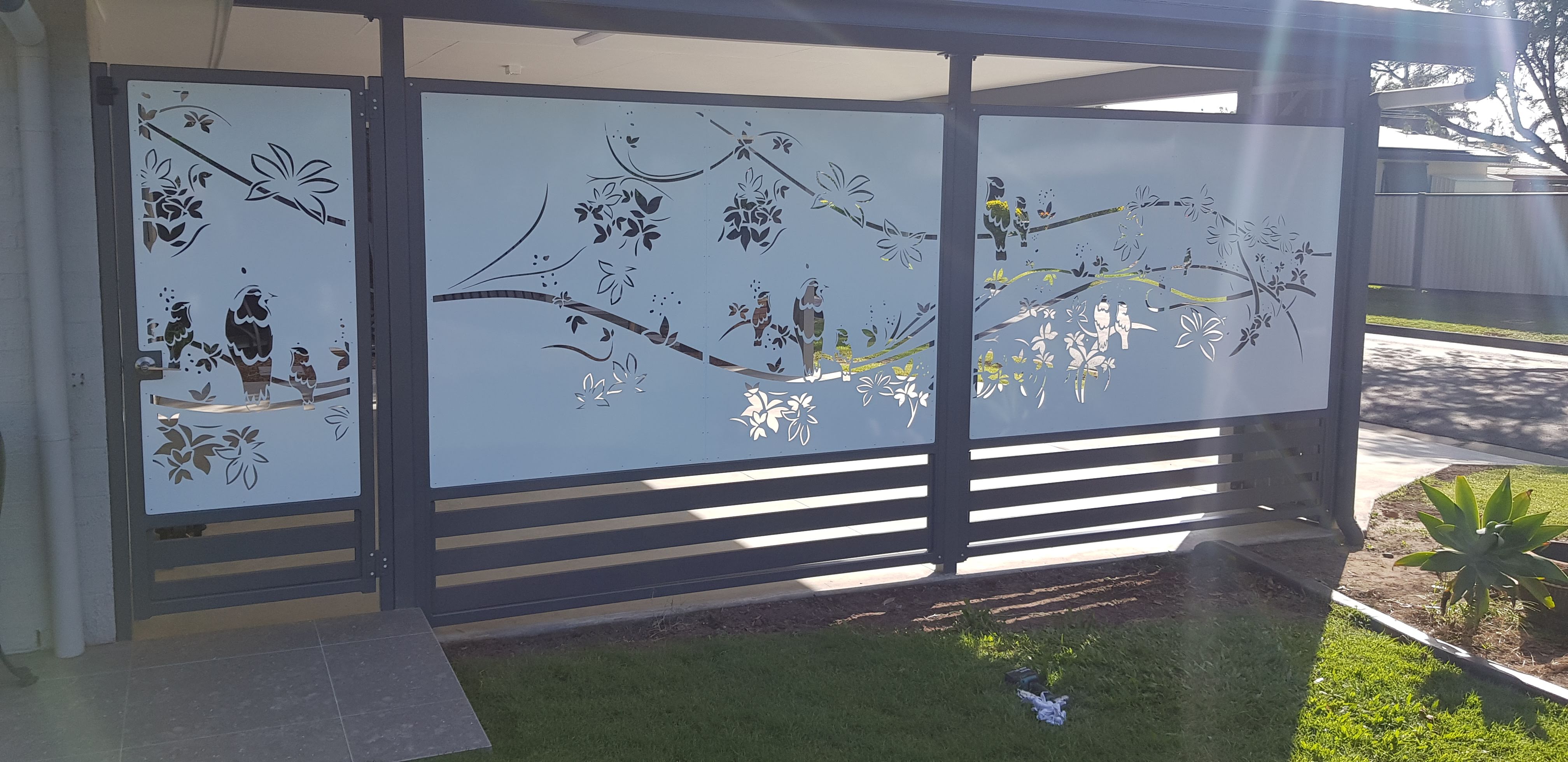 Laser-cut decorative aluminium privacy screen with tree branch pattern - Gateflex, Caboolture