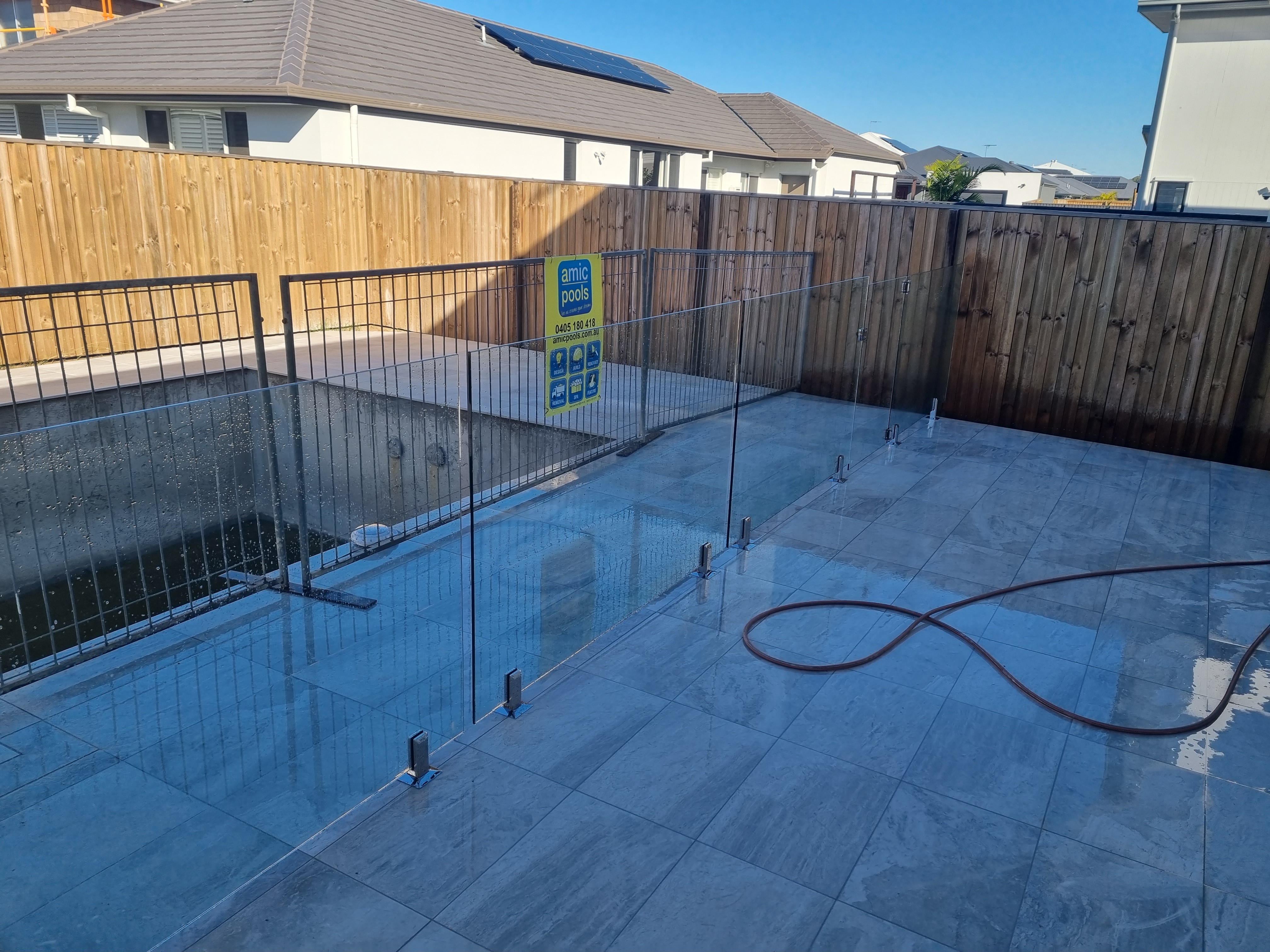 Beige horizontal slat aluminium fence with timber post detail in Clontarf - Gateflex, Clontarf