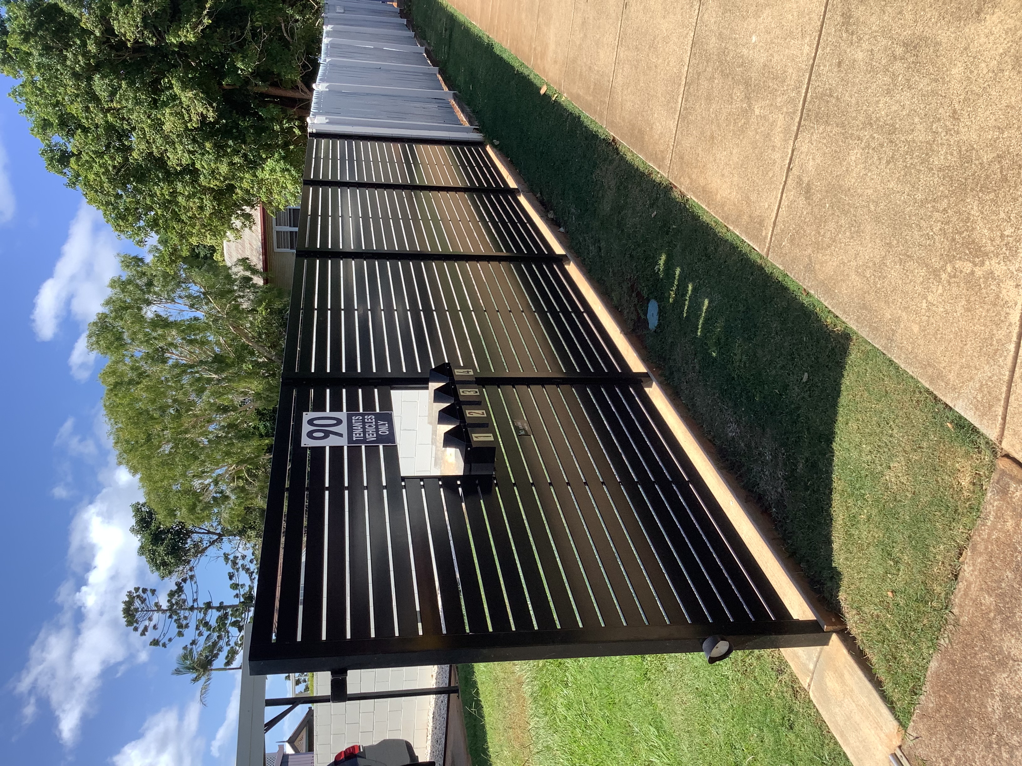 Black horizontal slat aluminium fence panels at a North Lakes property - Gateflex, North Lakes