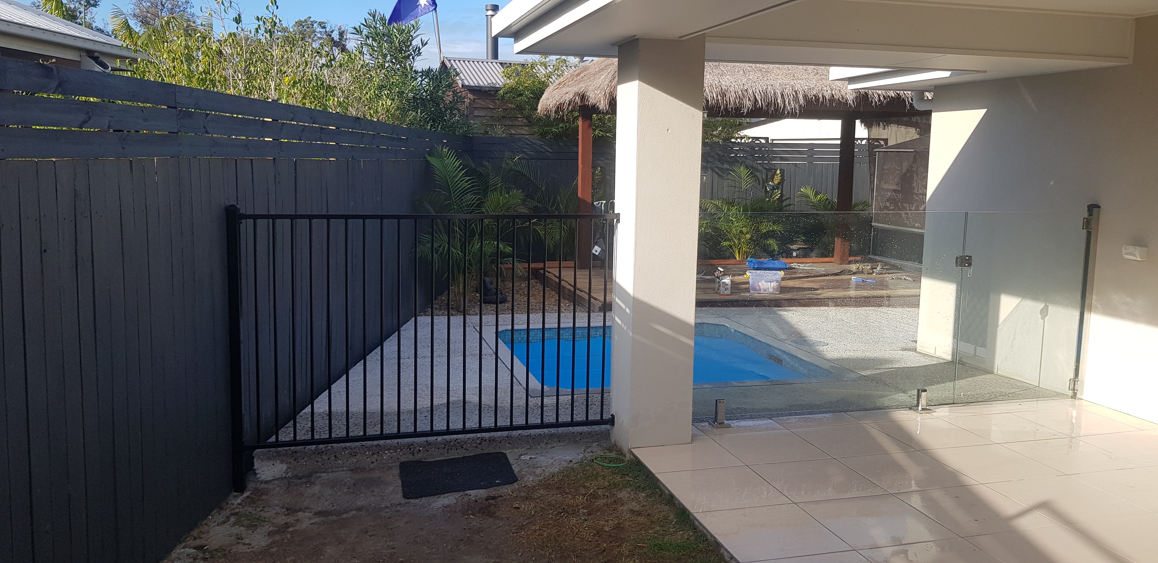 Black tubular driveway gate at the entry to a Redcliffe property - Gateflex, Redcliffe